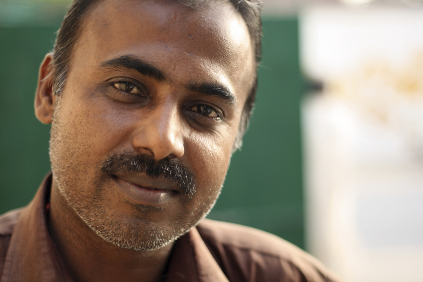 Close-up of an Indian man.